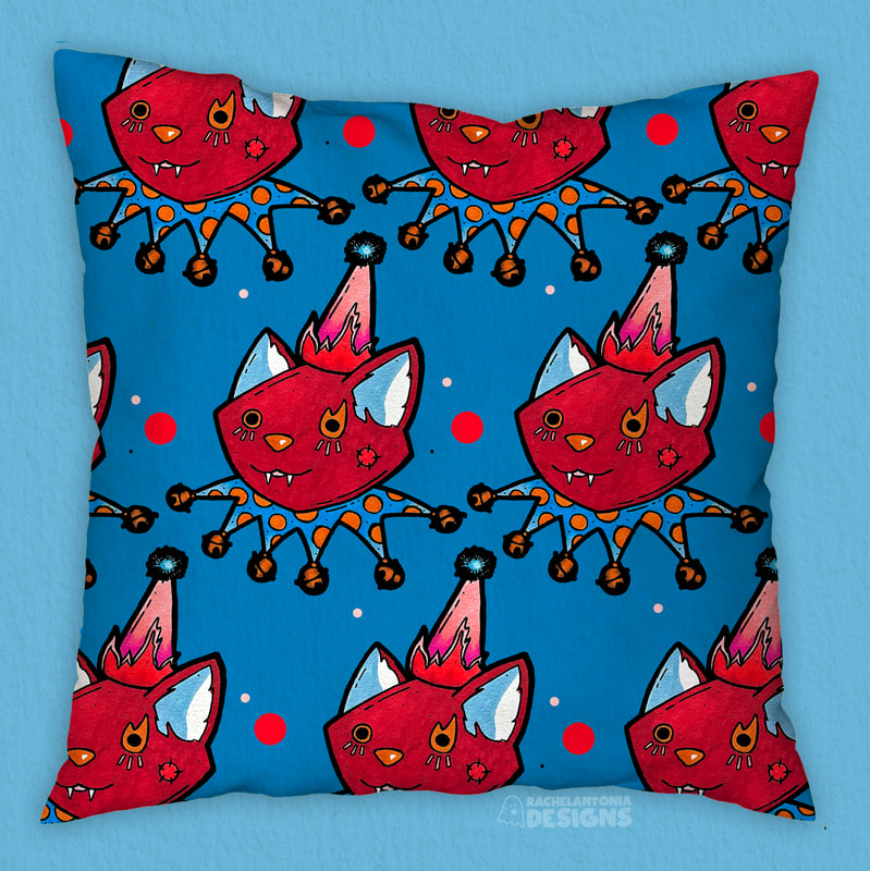 Pattern of a red cat with a clown costume on as a repeat pattern on a pillow